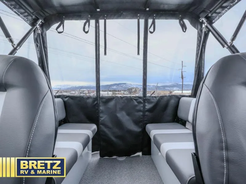 Slide: The Image of Interior of 2025 River Runner 180 boat with gray seating and panoramic windows. - 12