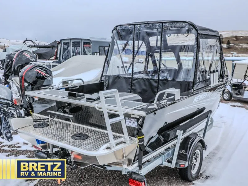 Slide: The Image of 2025 River Runner 180 boat with canopy, displayed at Bretz RV & Marine dealership. - 4