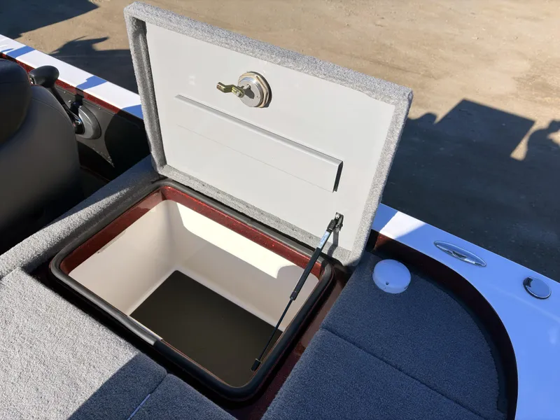 Slide: The Image of 2023 Caymas CX 18 SS boat storage compartment open, showing interior details. - 13