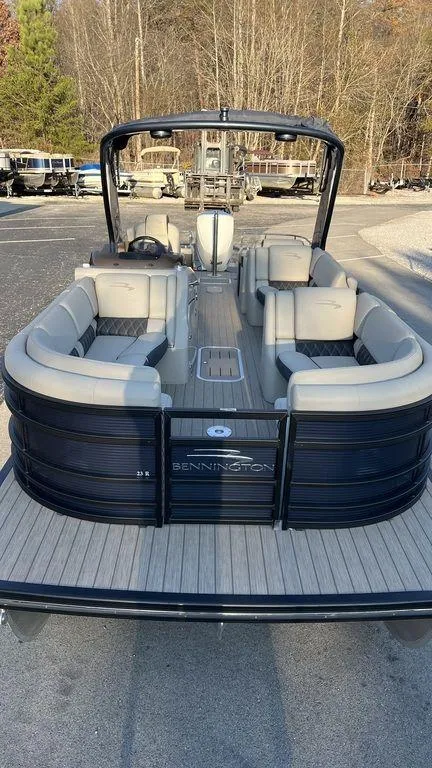 Slide: The Image of 2020 Bennington 23 RCW pontoon boat with spacious seating and sleek design. - 4