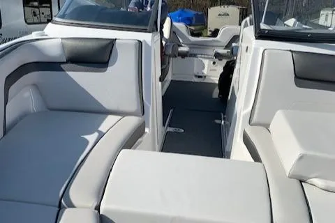 Slide: The Image of 2018 Yamaha Boats AR 240 interior with white seating and sleek design. - 4