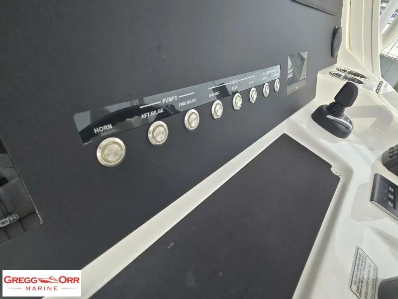 Slide: The Image of Control panel of 2024 Regulator 37 boat with labeled buttons and joystick. - 11