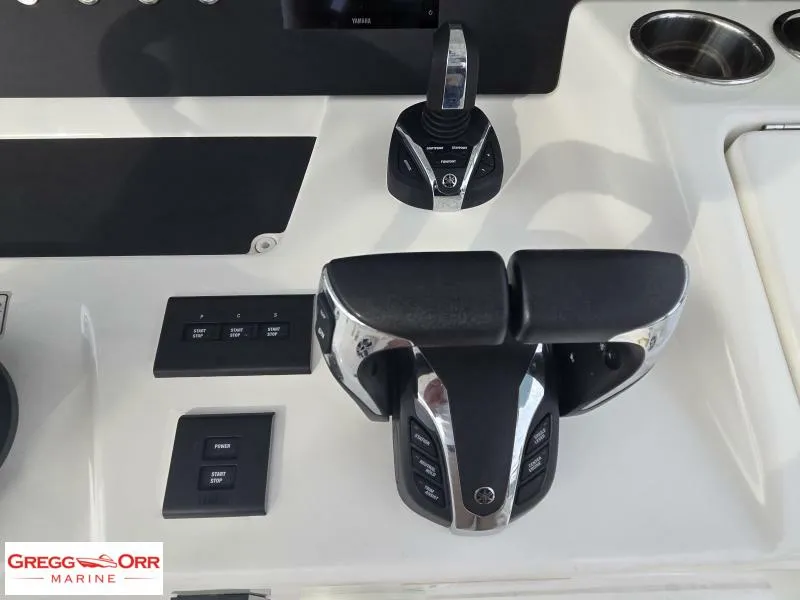 Slide: The Image of 2024 Regulator 37 boat controls with throttle and joystick at Gregg Orr Marine. - 12