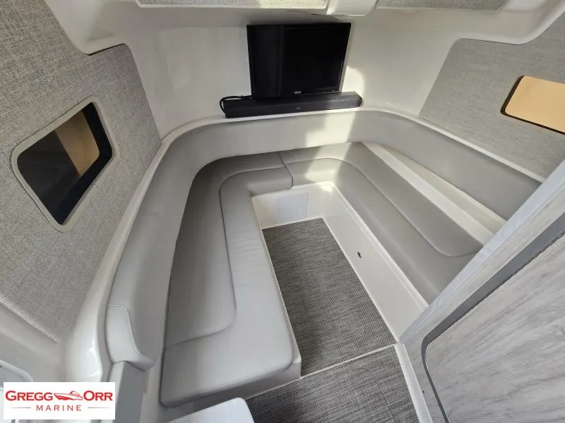 Slide: The Image of 2024 Regulator 37 cabin interior with seating and TV, featuring modern design and comfort. - 19