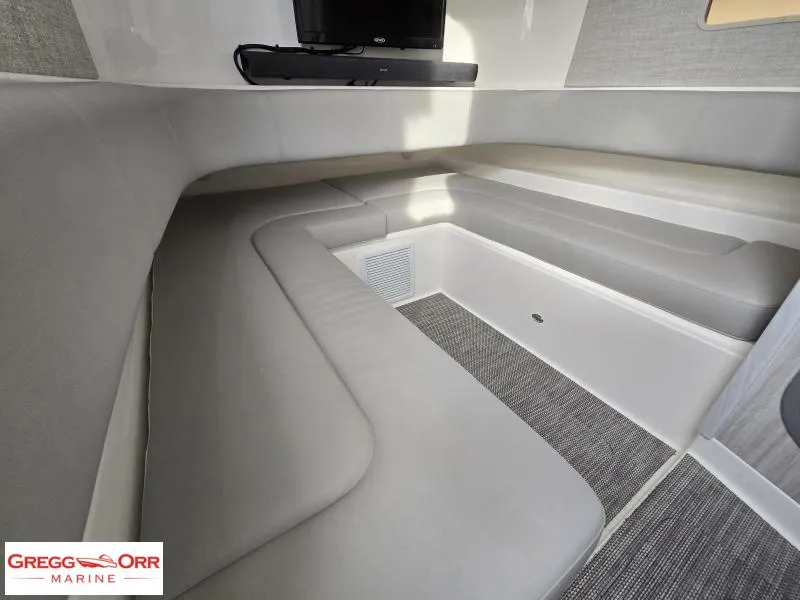 Slide: The Image of 2024 Regulator 37 cabin interior with cushioned seating and modern design. - 21