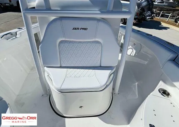 Slide: The Image of 2024 Sea Pro 222 CC boat interior with white seating and Gregg Orr Marine logo. - 11