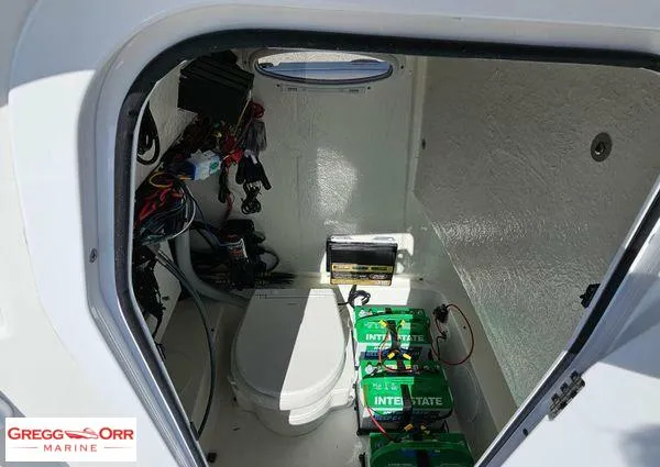 Slide: The Image of 2024 Sea Pro 222 CC boat interior with batteries and wiring. - 15