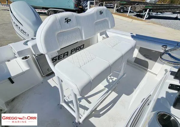 Slide: The Image of 2024 Sea Pro 222 CC boat interior with white seating and Gregg Orr Marine branding. - 20