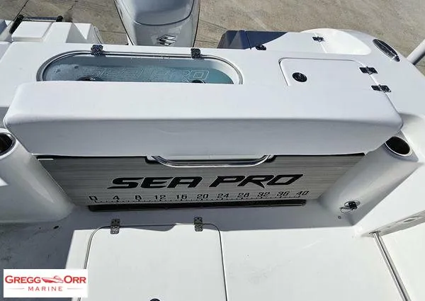 Slide: The Image of 2024 Sea Pro 222 CC boat deck with storage and measurement markings. - 21