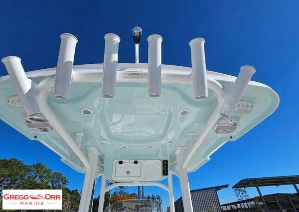 Slide: The Image of 2024 Sea Pro 222 CC boat with rod holders and T-top under clear blue sky. - 25