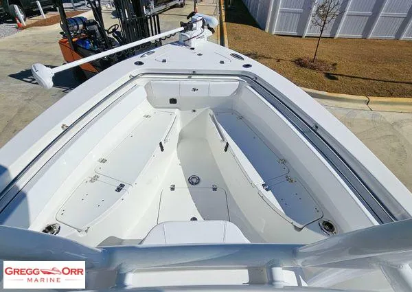 Slide: The Image of 2024 Sea Pro 222 CC boat deck with storage compartments, showcased at Gregg Orr Marine. - 8