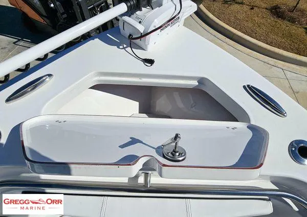 Slide: The Image of 2024 Sea Pro 222 CC boat deck with storage compartment and trolling motor. - 9