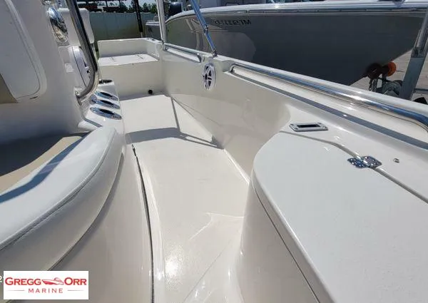 Slide: The Image of 2024 Bulls Bay 2200 boat interior with sleek white deck and seating. - 10