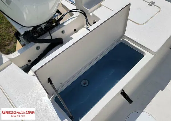 Slide: The Image of 2024 Bulls Bay 2200 boat with open storage compartment, featuring a sleek design. - 15