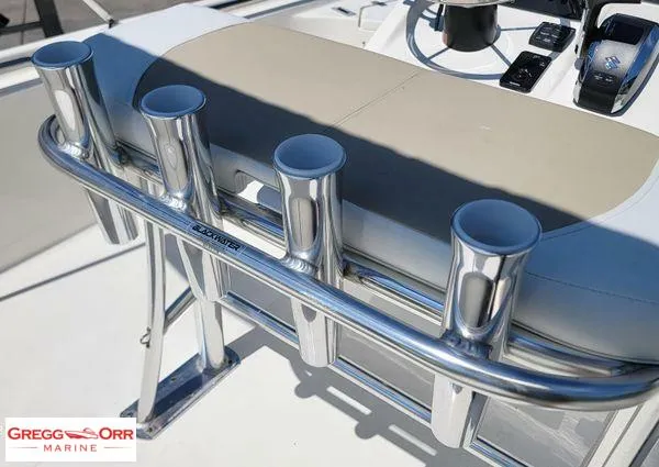 Slide: The Image of 2024 Bulls Bay 2200 boat with rod holders and console, Gregg Orr Marine branding. - 16
