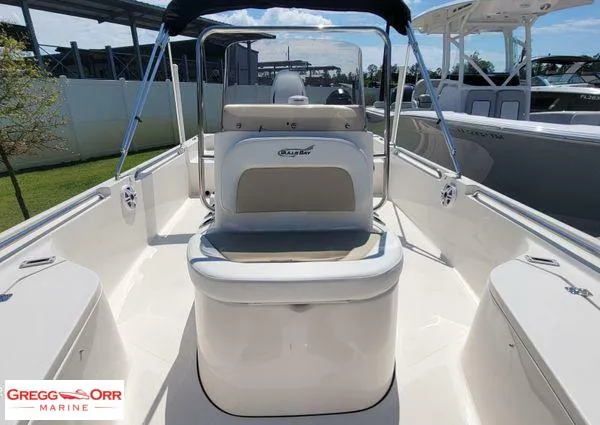 Slide: The Image of 2024 Bulls Bay 2200 boat interior with seating and console, displayed at Gregg Orr Marine. - 9