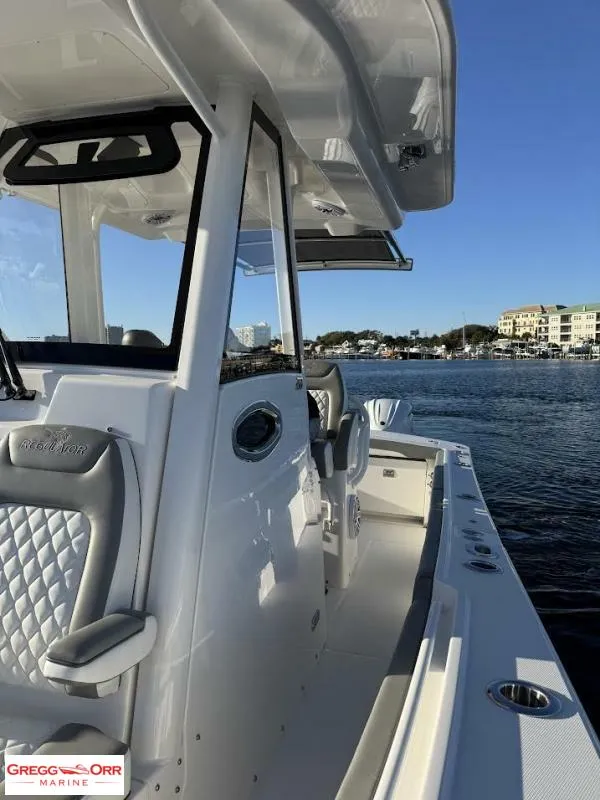 Slide: The Image of 2025 Regulator 28 boat on water, featuring sleek design and modern amenities. - 19