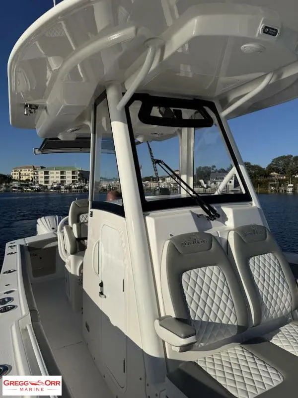 Slide: The Image of 2025 Regulator 28 boat with sleek design and comfortable seating on the water. - 20