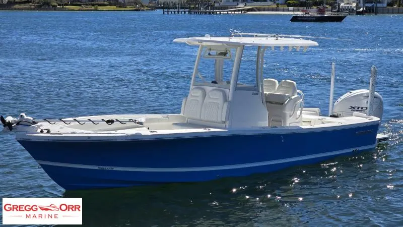 Slide: The Image of 2025 Regulator 26XO CROSSOVER boat on water, showcased by Gregg Orr Marine. - 2