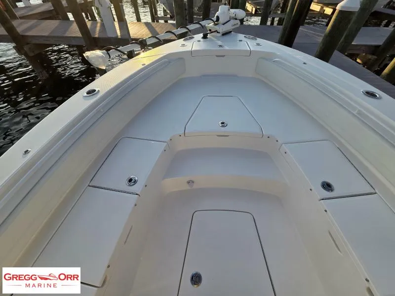 Slide: The Image of 2025 Regulator 26XO Crossover boat interior, featuring spacious seating and storage compartments. - 7