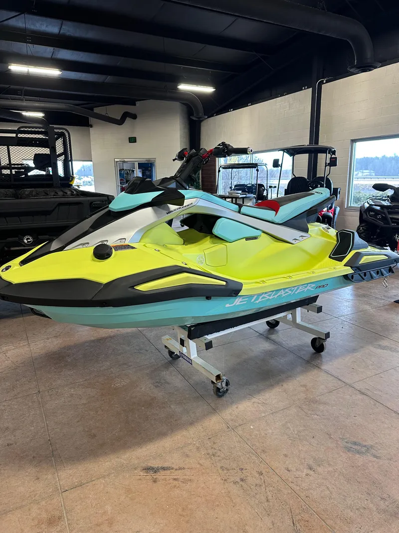 Slide: The Image of 2025 Yamaha WaveRunner JetBlaster PRO 2-Up in showroom, vibrant yellow and teal design. - 7