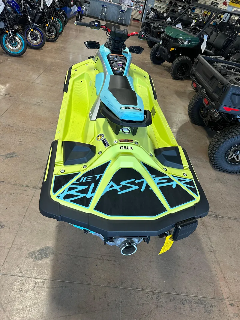 Slide: The Image of 2025 Yamaha WaveRunner JetBlaster PRO 2-Up in showroom, vibrant yellow and blue design. - 9