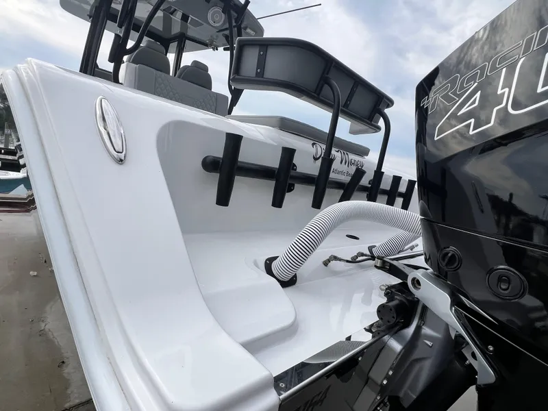 Slide: The Image of 2023 Front Runner 33 Center Console boat with powerful engine, sleek design. - 20