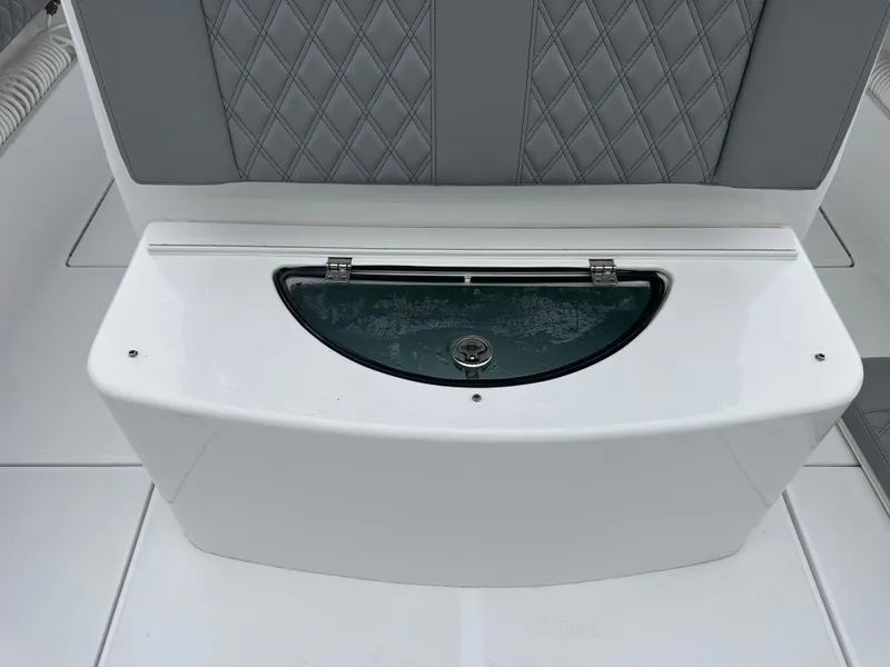 Slide: The Image of 2023 Front Runner 33 Center Console boat seat with storage compartment. - 27