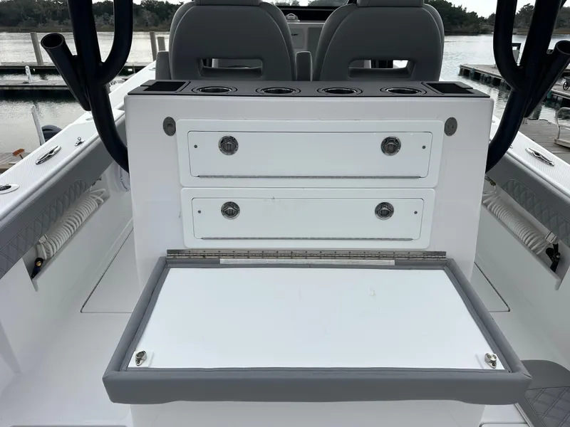 Slide: The Image of 2023 Front Runner 33 Center Console boat interior with storage drawers and seating. - 28