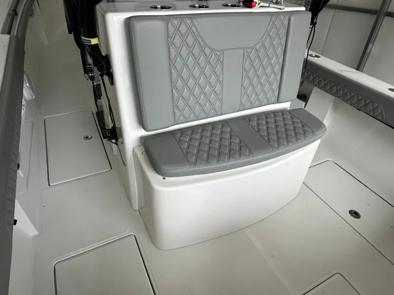 Slide: The Image of 2023 Front Runner 33 Center Console interior with gray diamond-stitched seating. - 30