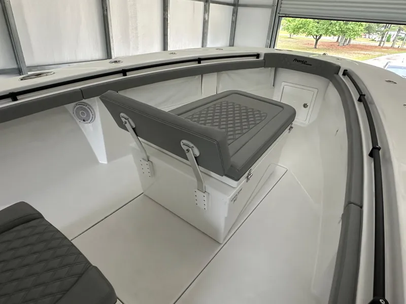 Slide: The Image of 2023 Front Runner 33 Center Console boat interior with cushioned seating. - 31
