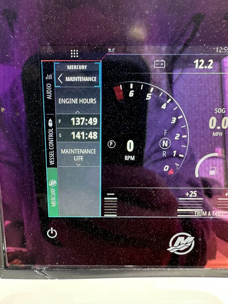 Slide: The Image of Boat dashboard display showing engine hours and maintenance for 2023 Front Runner 33 Center Console. - 33