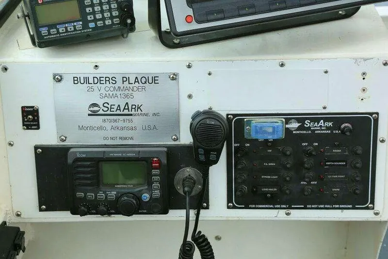 Slide: The Image of Control panel of 2002 SeaArk 25 V Commander SAMA 1365 with communication devices. - 15