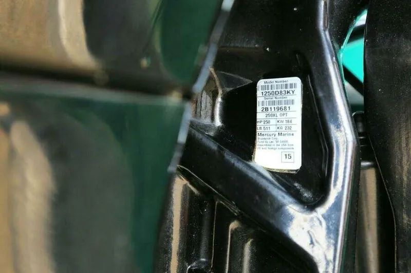 Slide: The Image of Close-up of a 2002 SeaArk 25 V Commander SAMA 1365 model label. - 27