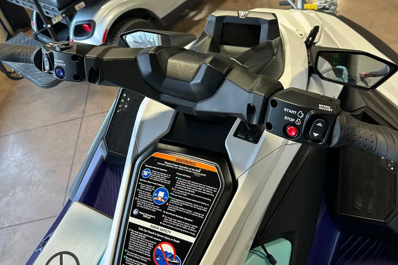Slide: The Image of 2025 Yamaha WaveRunner JetBlaster LTD dashboard and controls, featuring start/stop buttons and safety warnings. - 9