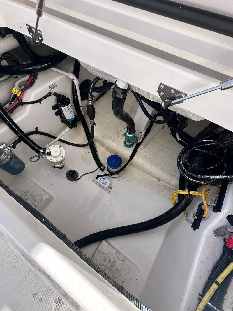 Slide: The Image of 2024 Regulator 24XO boat interior wiring and components. - 12