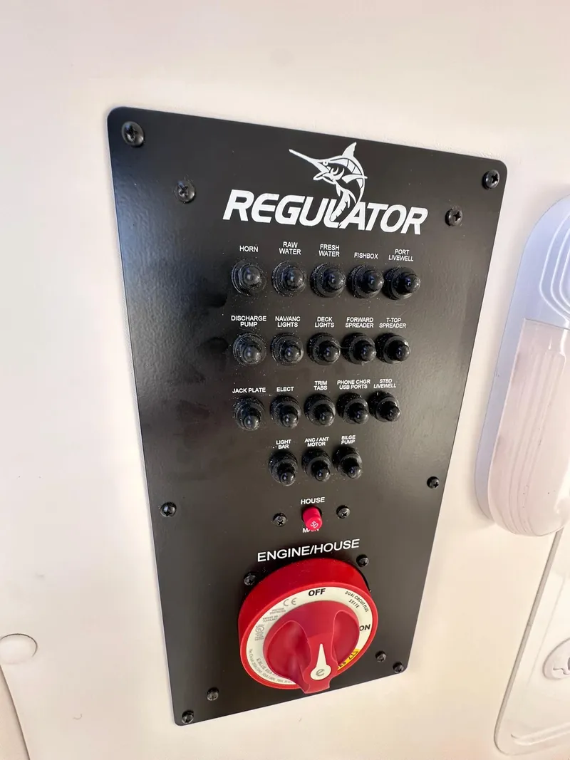 Slide: The Image of 2024 Regulator 24XO control panel with switches and engine/house selector. - 15