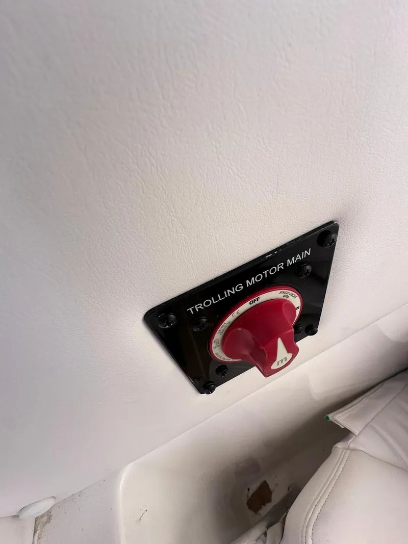 Slide: The Image of 2024 Regulator 24XO trolling motor switch with red knob on white panel. - 16