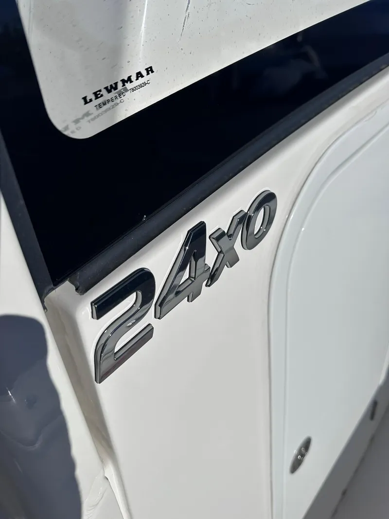 Slide: The Image of 2024 Regulator 24XO boat emblem close-up with Lewmar branding. - 18