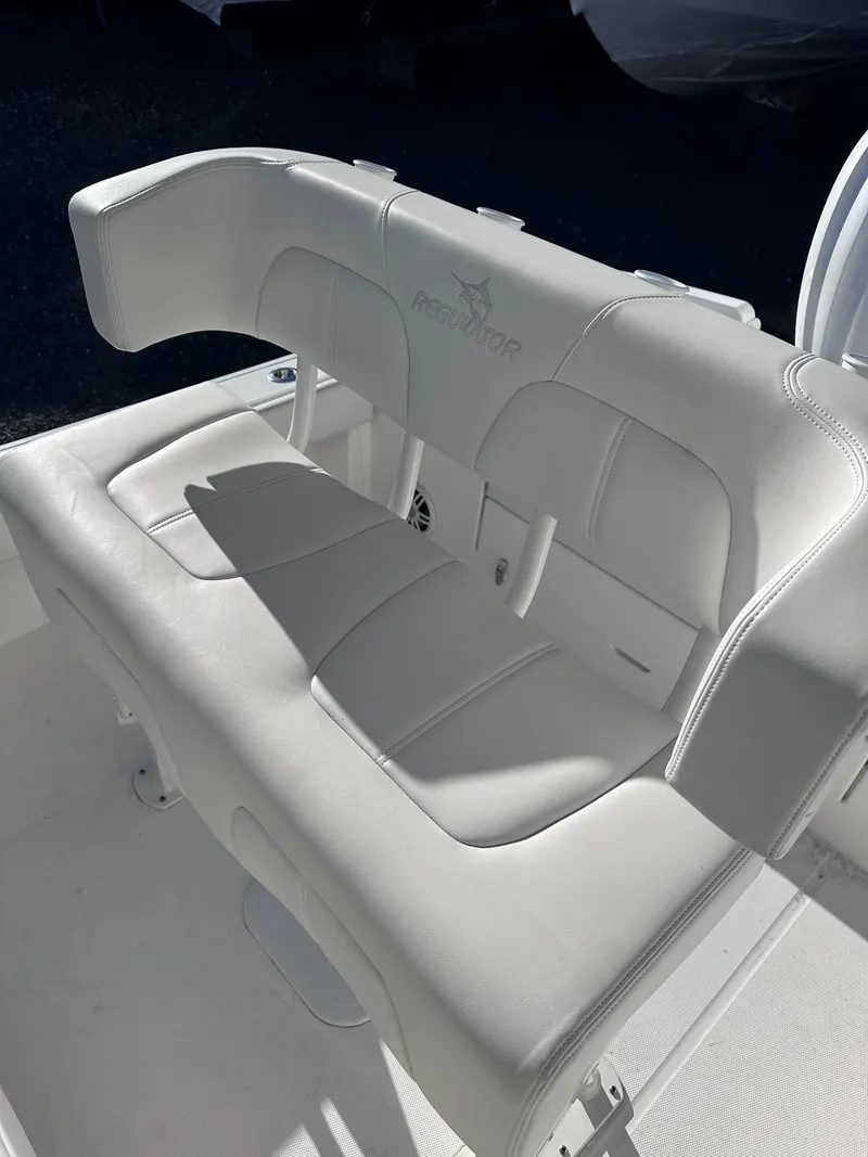Slide: The Image of 2024 Regulator 24XO boat seat, white upholstery, sleek design. - 19