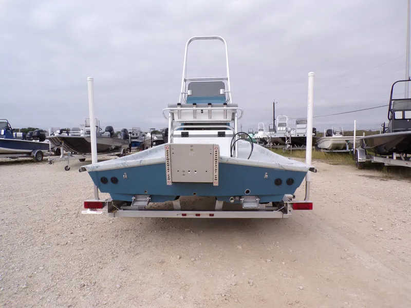 Slide: The Image of 2025 Shoalwater 19 CAT boat on trailer, rear view, in outdoor lot. - 10