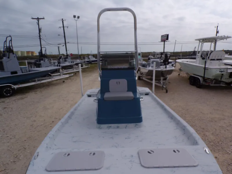 Slide: The Image of 2025 Shoalwater 19 CAT boat displayed in a dealership lot. - 13