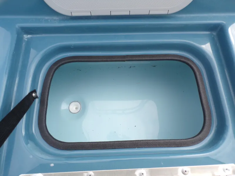 Slide: The Image of Shoalwater 19 CAT 2025 boat livewell, blue interior, top view. - 18