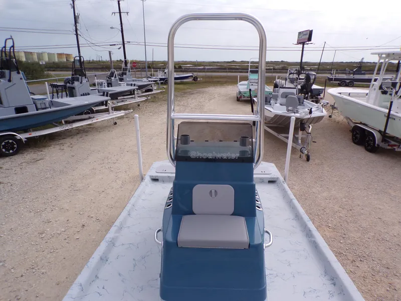 Slide: The Image of 2025 Shoalwater 19 CAT boat displayed outdoors, surrounded by other boats. - 19