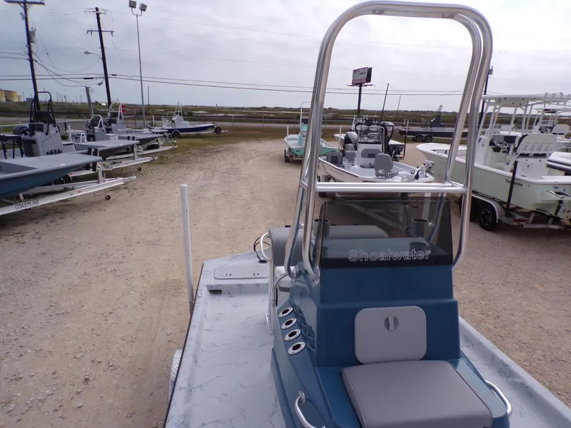 Slide: The Image of 2025 Shoalwater 19 CAT boat on display at a dealership. - 20