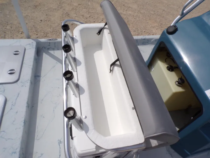 Slide: The Image of 2025 Shoalwater 19 CAT boat interior with rod holders and storage compartment. - 27