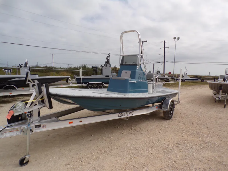 Slide: The Image of 2025 Shoalwater 19 CAT boat on trailer in outdoor lot. - 3
