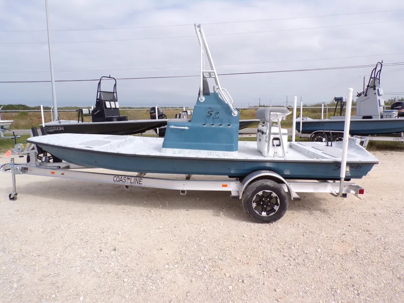 Slide: The Image of 2025 Shoalwater 19 CAT boat on trailer, displayed outdoors. - 33