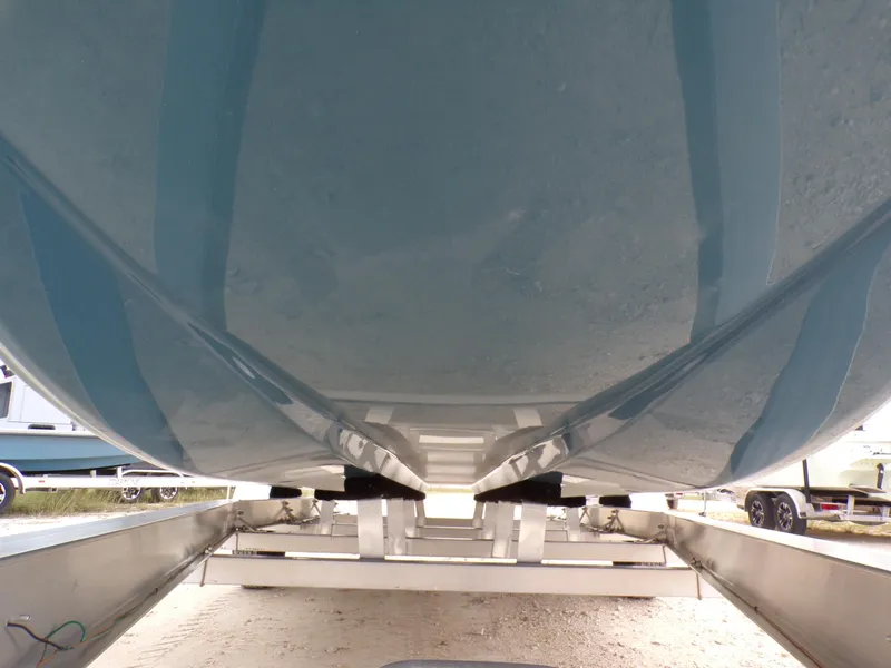 Slide: The Image of Underside view of 2025 Shoalwater 19 CAT boat on trailer. - 6