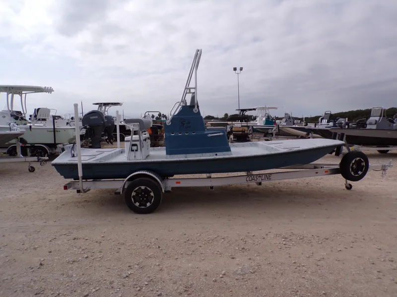 Slide: The Image of 2025 Shoalwater 19 CAT boat on trailer in outdoor lot. - 8